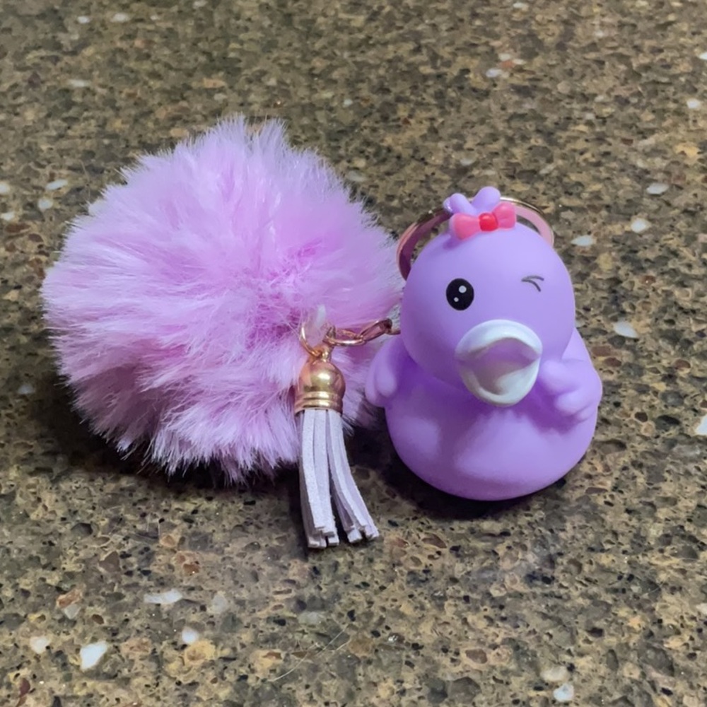 LAVENDER WINKY FACE RUBBER DUCKIE